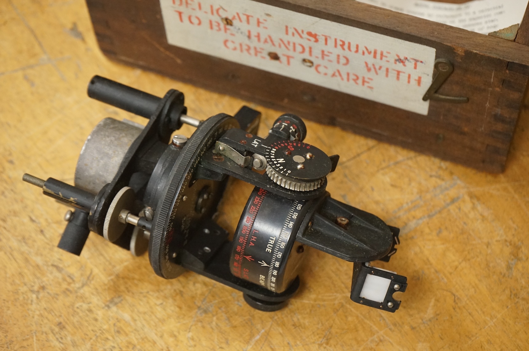 A WWII cased RAF Air Ministry Astro Compass MKII, the inside lid of the case stamped examined 24 March 1943, case dimensions 16.5cm wide, 16cm high, 13.5cm deep